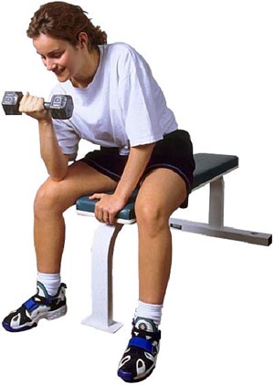 Fish oil benefits for prevention soreness of muscles after workout. Woman lifting weights.
