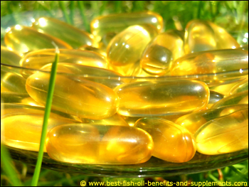Fish oil supplements capsules in the sunlight.